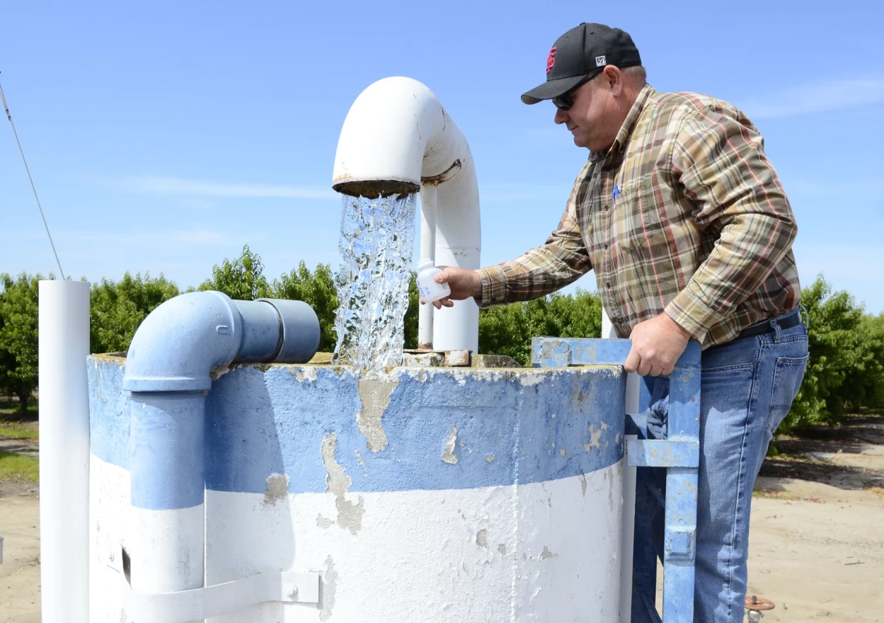 FILE PHOTO: Water comes out of a well.